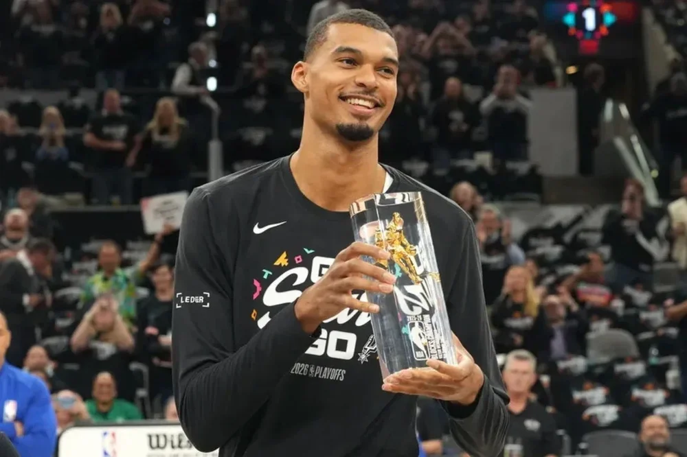 Apr 21, 2026; San Antonio, Texas, USA; San Antonio Spurs forward Victor Wembanyama (1) holds up his Defensive Player of the Year award before game two of the first round of the 2026 NBA Playoffs against the Portland Trail Blazers at Frost Bank Center. Mandatory Credit: Scott Wachter-Imagn Images